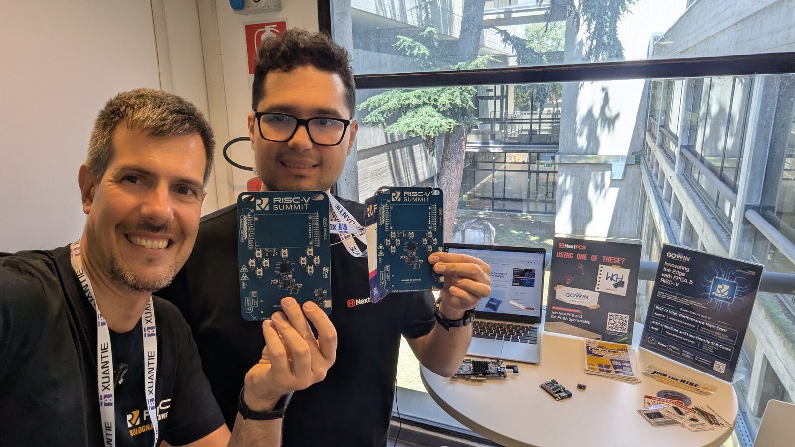 Holding a RISC-V development board at the Summit, representing hands-on RISC-V