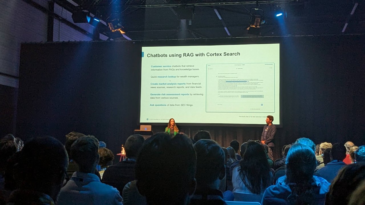 Chatbots using RAG with Cortex Search slide at Snowflake World Tour Amsterdam 2024, with two presenters on stage