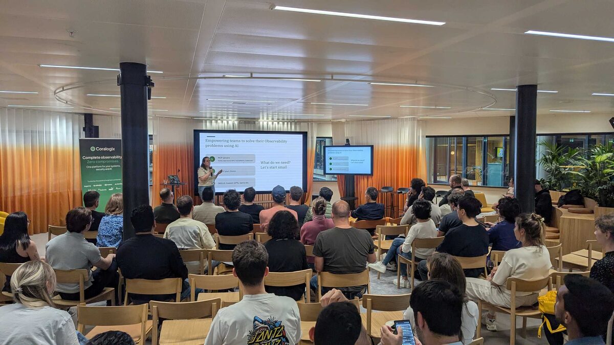 Iris Dyrmishi presenting Observability for Engineers at Miro Amsterdam office — SRE NL meetup