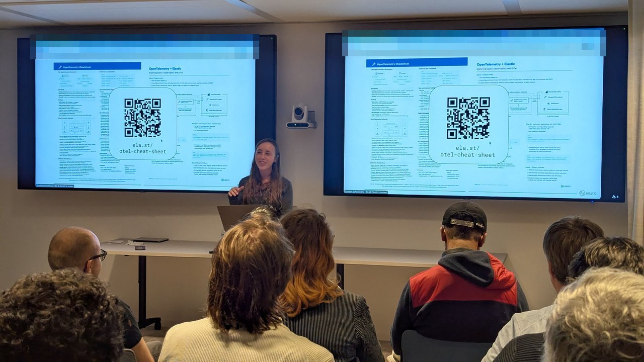 Evelien Schellekens presenting the OpenTelemetry cheat sheet slide with the ela.st/otel-cheat-sheet link at the SRE NL meetup
