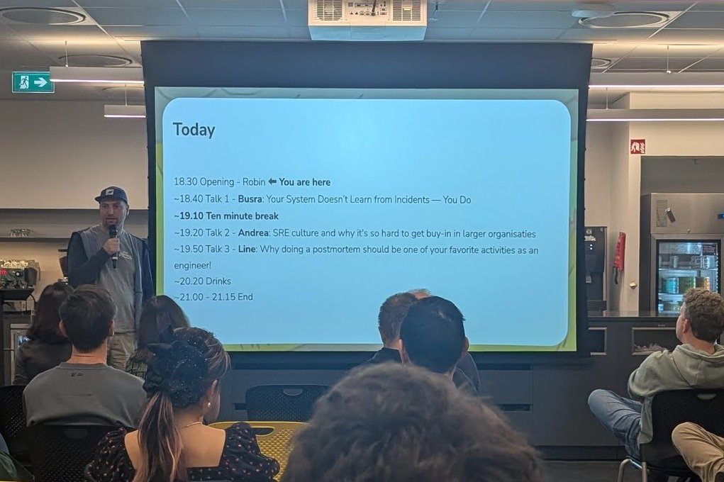 The SRE NL agenda slide: opening by Robin, Busra on learning from incidents, a ten-minute break, Andrea on SRE culture, Line on postmortems, then drinks