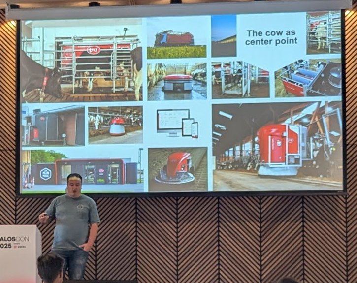 Slide titled The cow as center point showing a collage of barns, cows, robotic farm equipment and dashboards