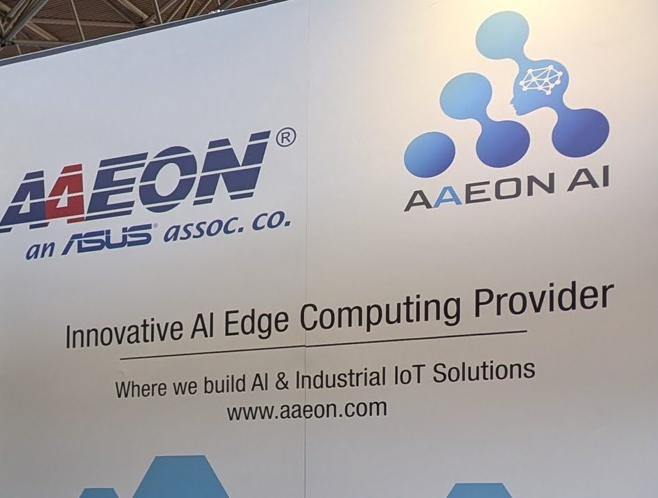 The AAEON booth wall: AAEON, an ASUS associated company, Innovative AI Edge Computing Provider, Where we build AI and Industrial IoT Solutions