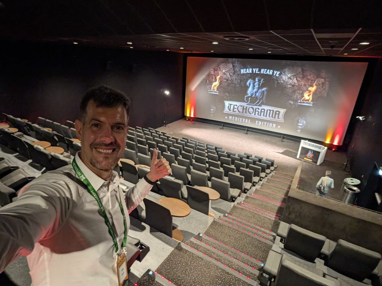 Luca Berton in an empty session room at Techorama Netherlands 2026, the screen announcing the medieval edition