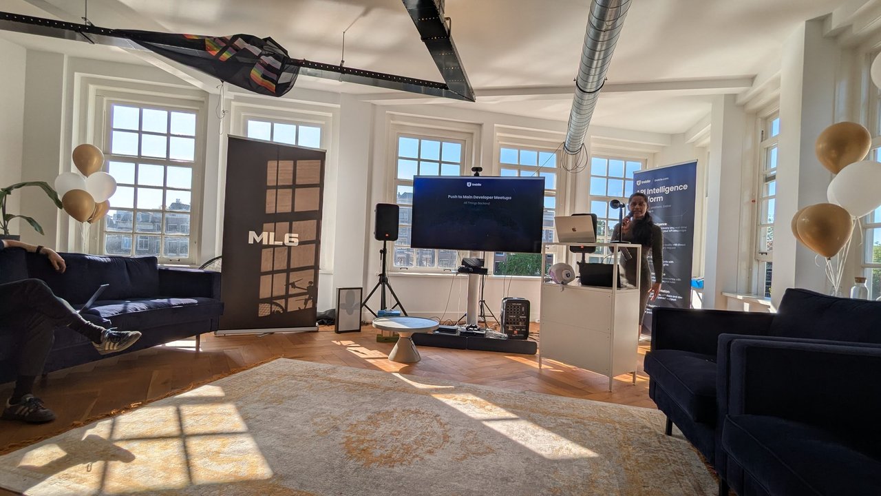 Stage at the Treblle MCP meetup at ML6 in Amsterdam, with a speaker at the podium and a Treblle API Intelligence Platform banner on the right