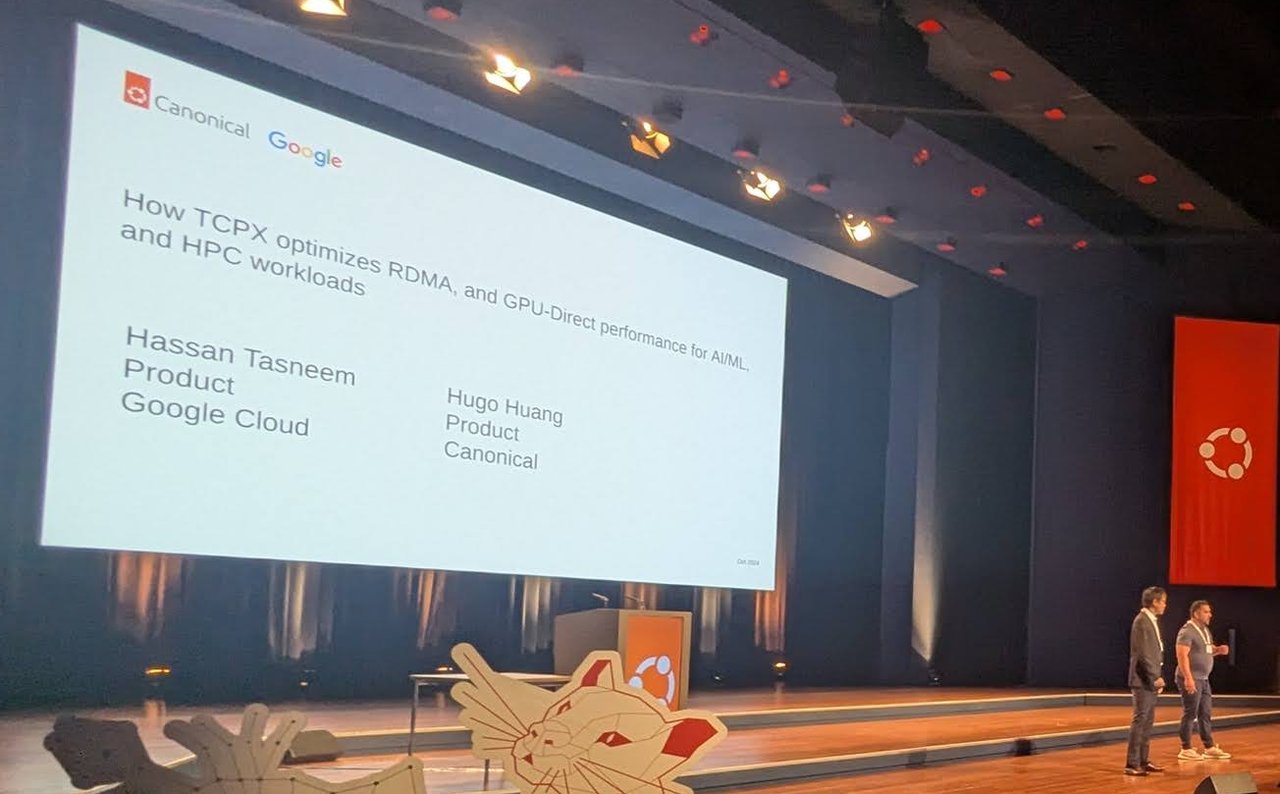 Hassan Tasneem of Google Cloud and Hugo Huang of Canonical on stage under their title slide How TCPX optimizes RDMA, and GPU-Direct performance for AI/ML, and HPC workloads