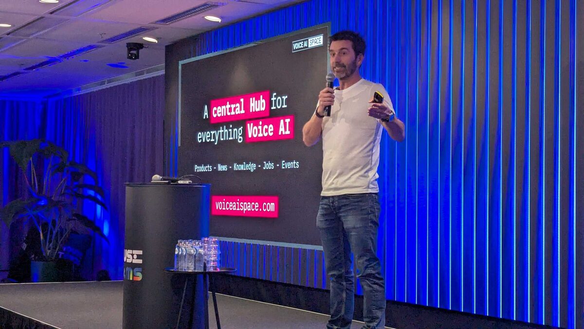 Full-body shot of Voice AI Space organizer presenting the platform vision