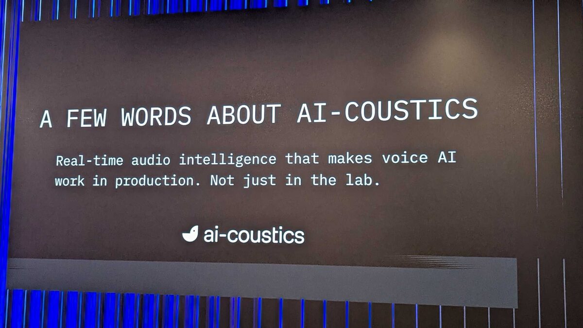 ai-coustics slide — "A FEW WORDS ABOUT AI-COUSTICS: Real-time audio intelligence that makes voice AI work in production. Not just in the lab."