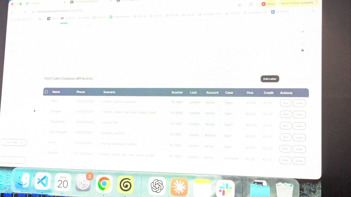 Fini YEGO demo projected on stage — full database view showing caller scenarios on the big screen