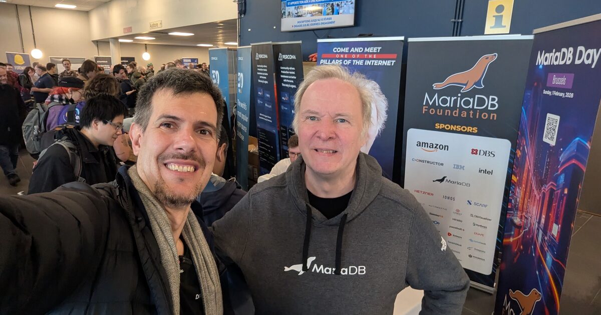 Luca Berton with Monty Widenius at the MariaDB Foundation booth, FOSDEM 2026
