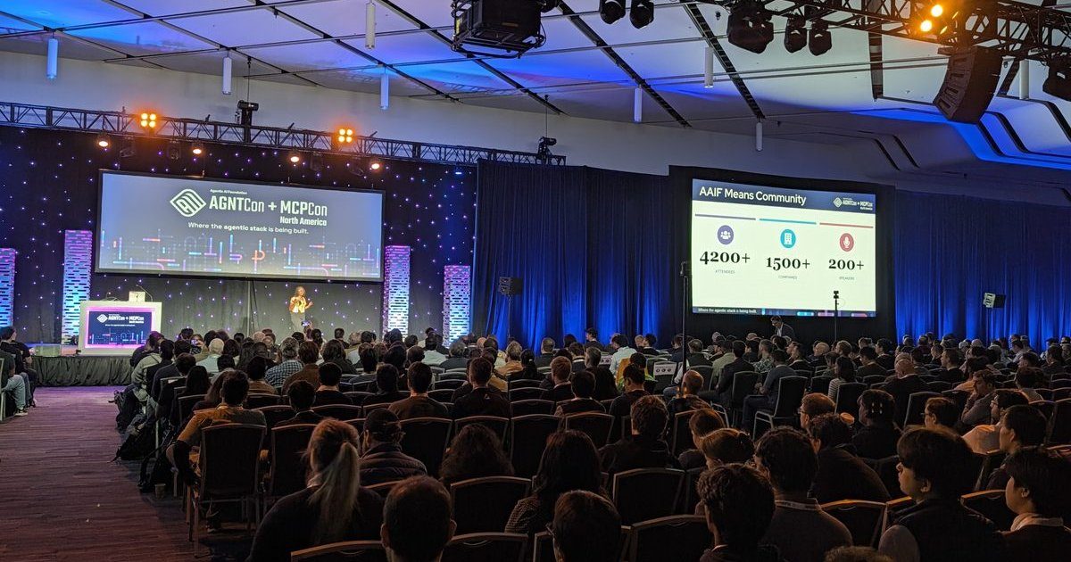 The AGNTCon + MCPCon North America keynote hall in San Jose, with the slide AAIF Means Community on the side screen