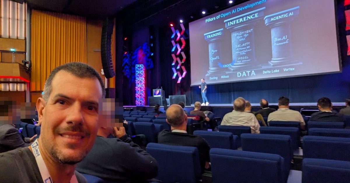 Luca Berton in the AI_dev Europe 2025 auditorium at RAI Amsterdam, with the Pillars of Open AI Development slide on stage