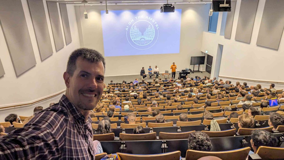 Luca Berton selfie at AI on the Amstel meetup with packed auditorium at VU Amsterdam