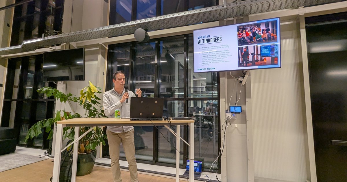 The AI Tinkerers Amsterdam host opening the February 2025 meetup in front of the Who We Are slide