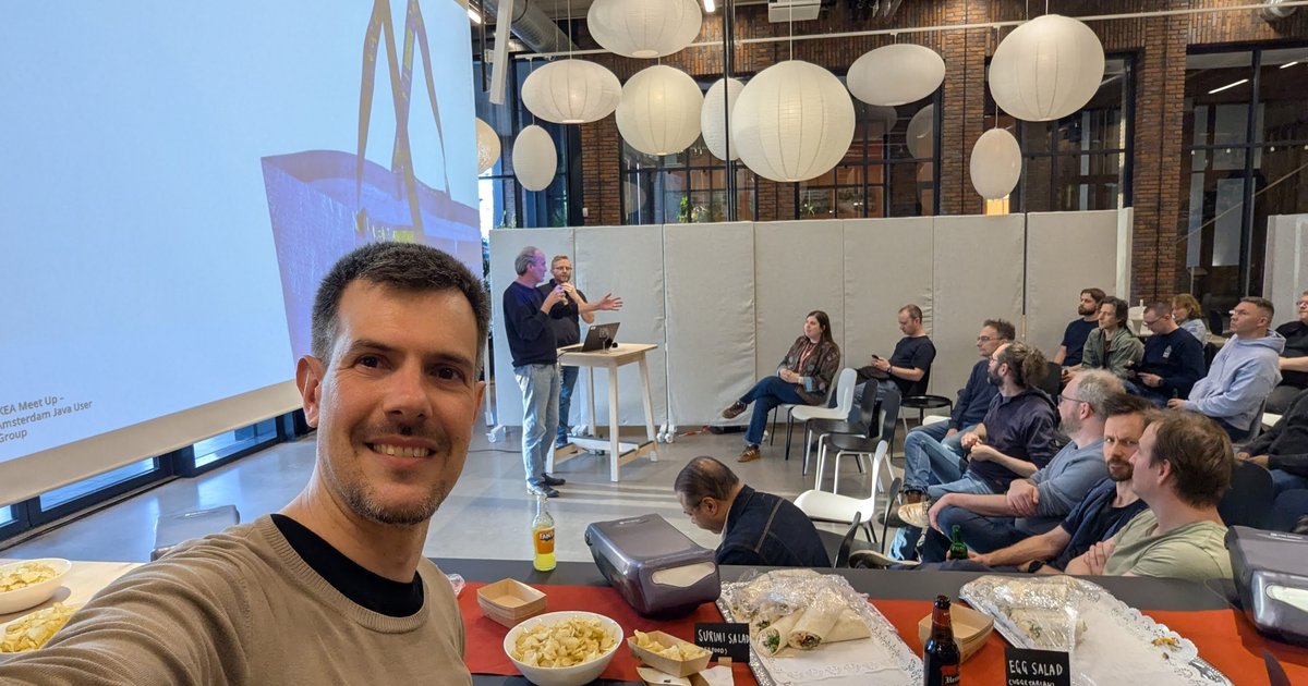 Luca Berton at the IKEA Meet Up of the Amsterdam Java User Group, with the hosts on stage and the audience behind him