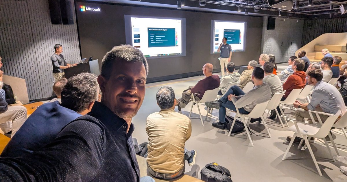 The Azure Heroes meetup room in Amsterdam during the closing talk, with a How to Boost Generative AI adoption slide on the screens