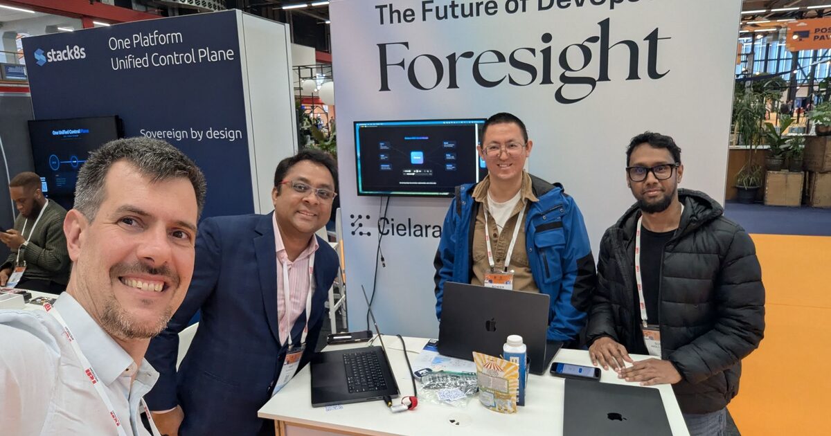 Luca Berton with the Cielara AI team at KubeCon Europe 2026 booth - The Future of DevOps is Foresight