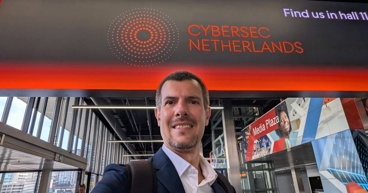Luca Berton taking a selfie under the Cybersec Netherlands sign at Jaarbeurs Utrecht, next to the Media Plaza