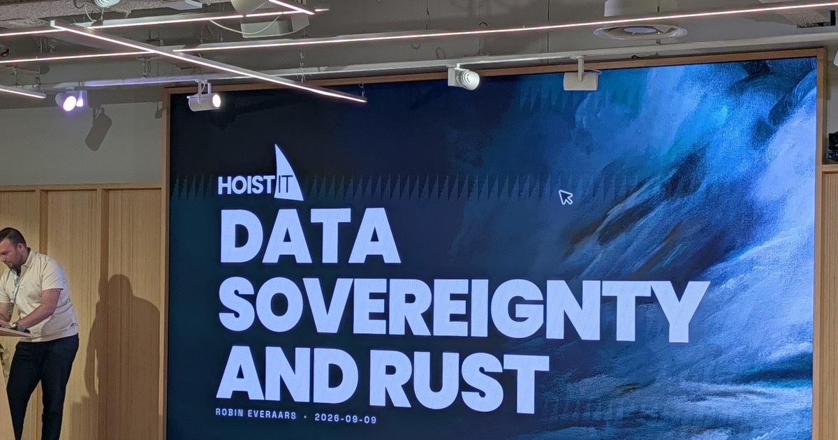 Robin Everaars at the podium next to the HoistIT title slide Data Sovereignty and Rust at the Rust AI Europe meetup at Adyen, Amsterdam