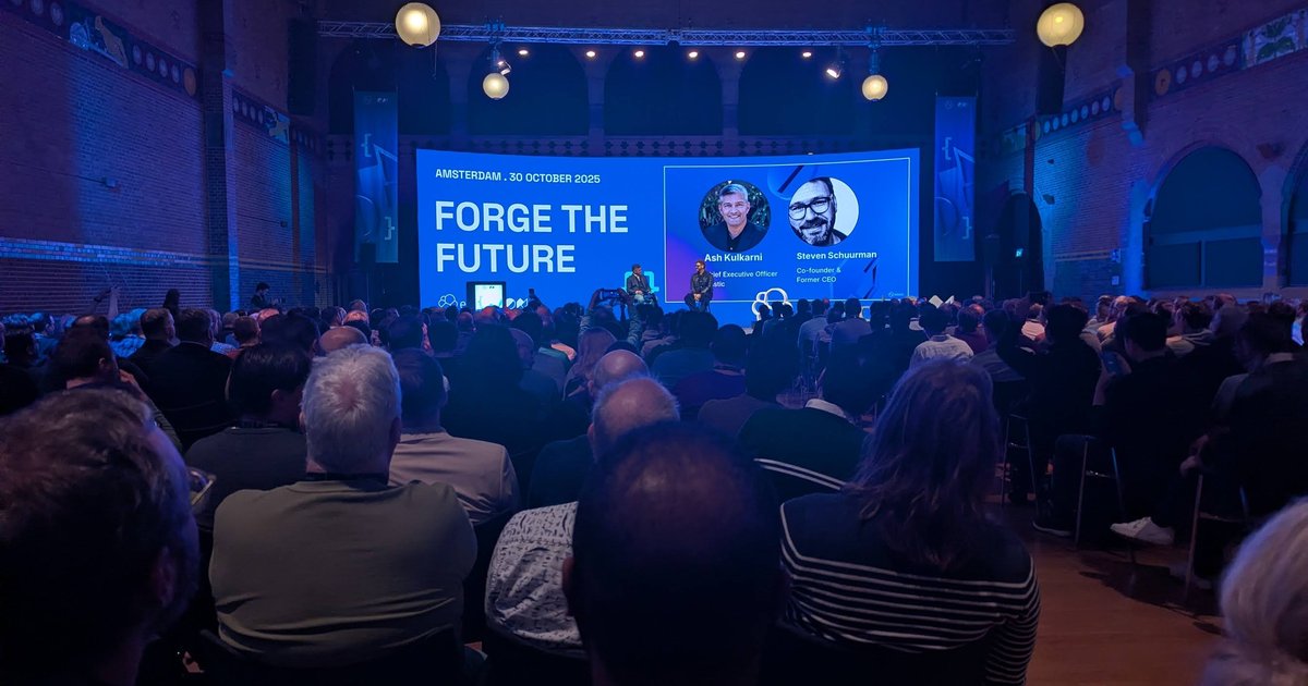 Ash Kulkarni and Steven Schuurman on stage at ElasticON Amsterdam 2025 under the Forge the Future banner at the Beurs van Berlage