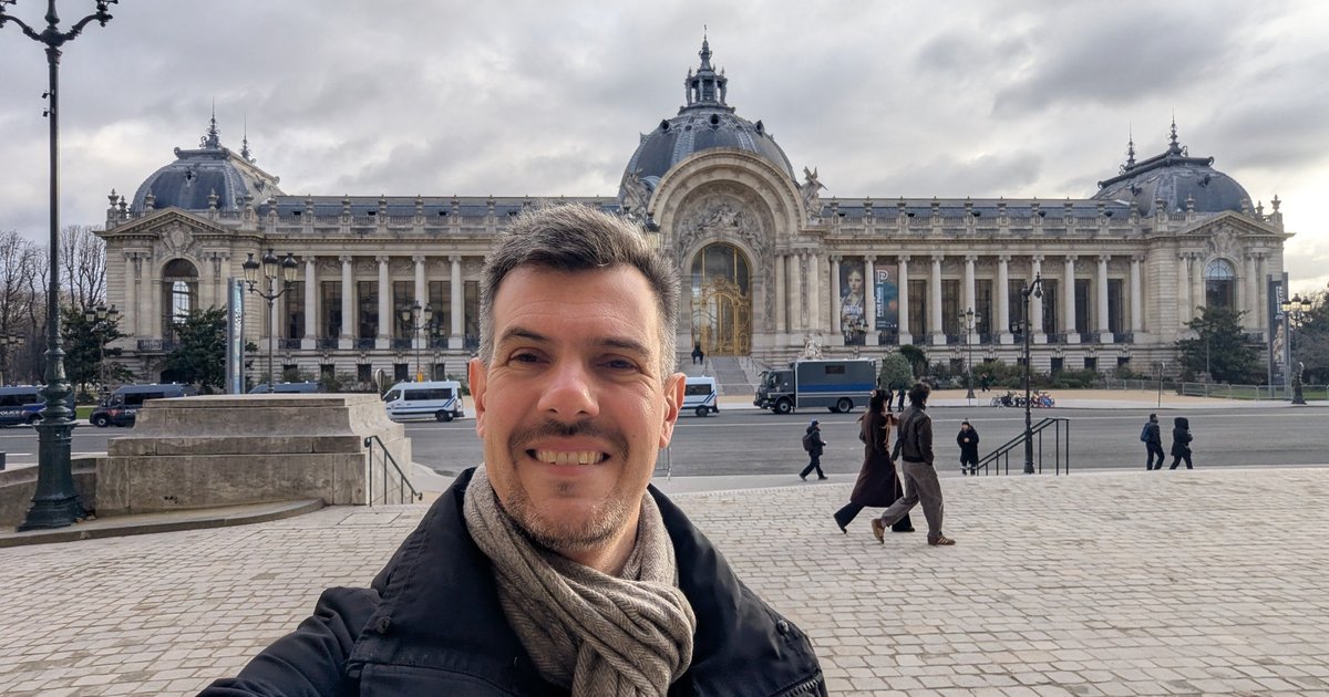 Luca Berton taking a selfie in front of the Petit Palais in Paris on a cloudy January morning