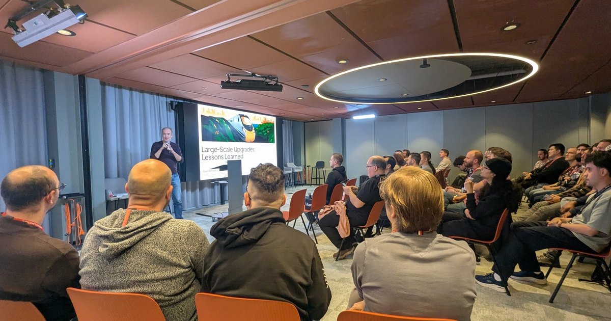 Pavel Belousov presenting Large-Scale Upgrades: Lessons Learned to a seated audience at the Friends of OpenJDK meetup at Uber in Amsterdam