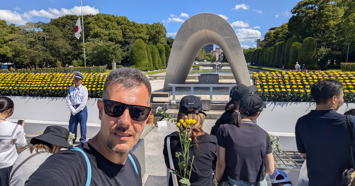 Cenotaph for the A-bomb Victims framing the Flame of Peace and the A-Bomb Dome at Hiroshima Peace Memorial Park