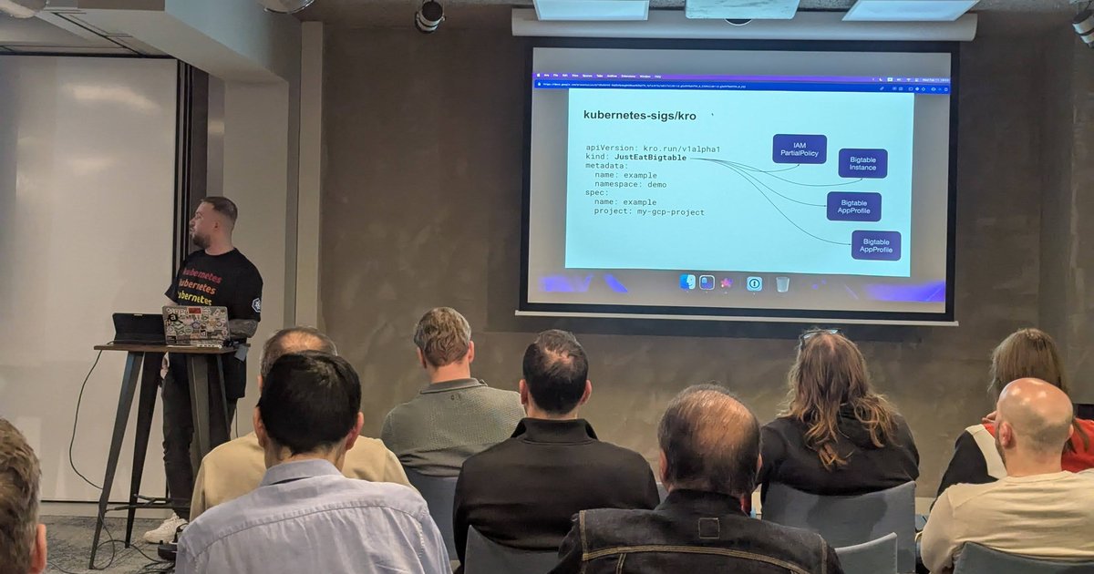 Speaker presenting a kubernetes-sigs/kro slide with a JustEatBigtable instance that fans out to IAM and Bigtable resources, at a Xebia meetup in Amsterdam