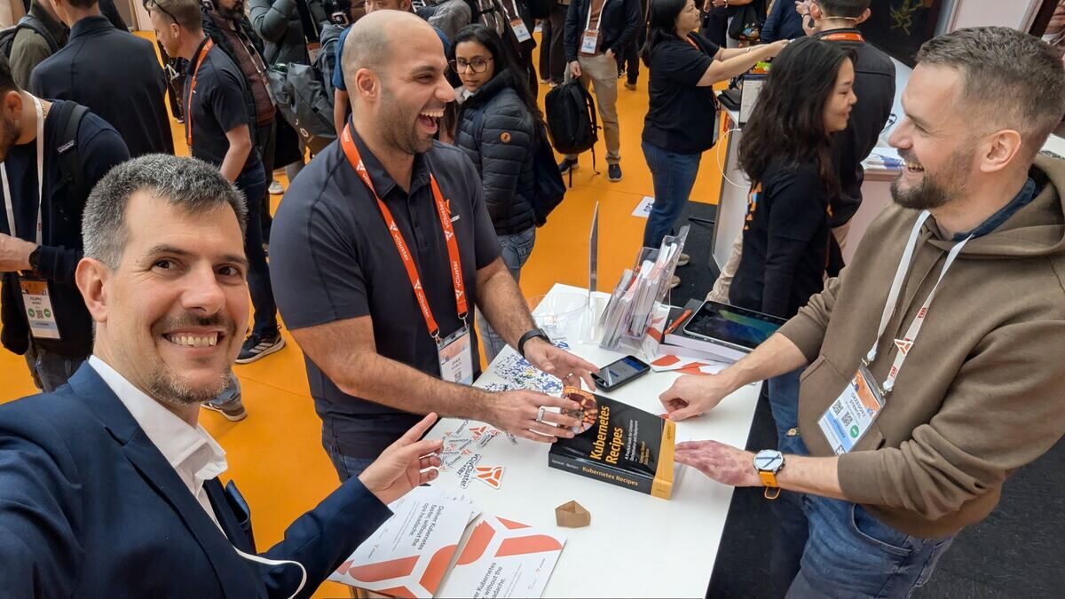 Book signing at the vCluster booth, KubeCon Europe 2026