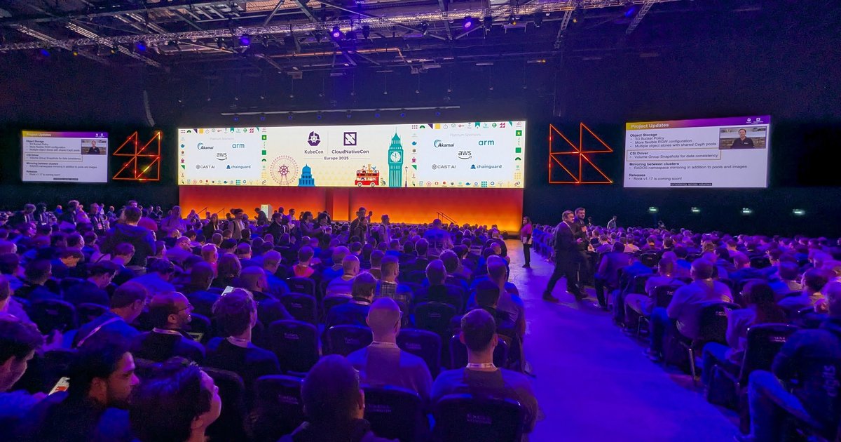The keynote hall at ExCeL London during KubeCon Europe 2025 with a large screen and a seated audience