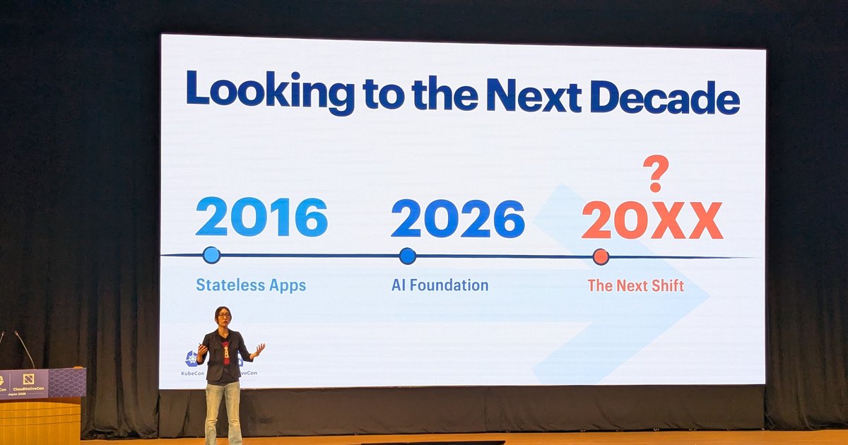 A Preferred Networks speaker on the KubeCon Japan 2026 main stage in front of a Looking to the Next Decade slide reading 2016, 2026 and 20XX