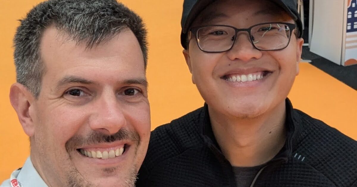 Luca Berton with JJ Tang from Rootly AI at KubeCon Europe 2026 expo floor
