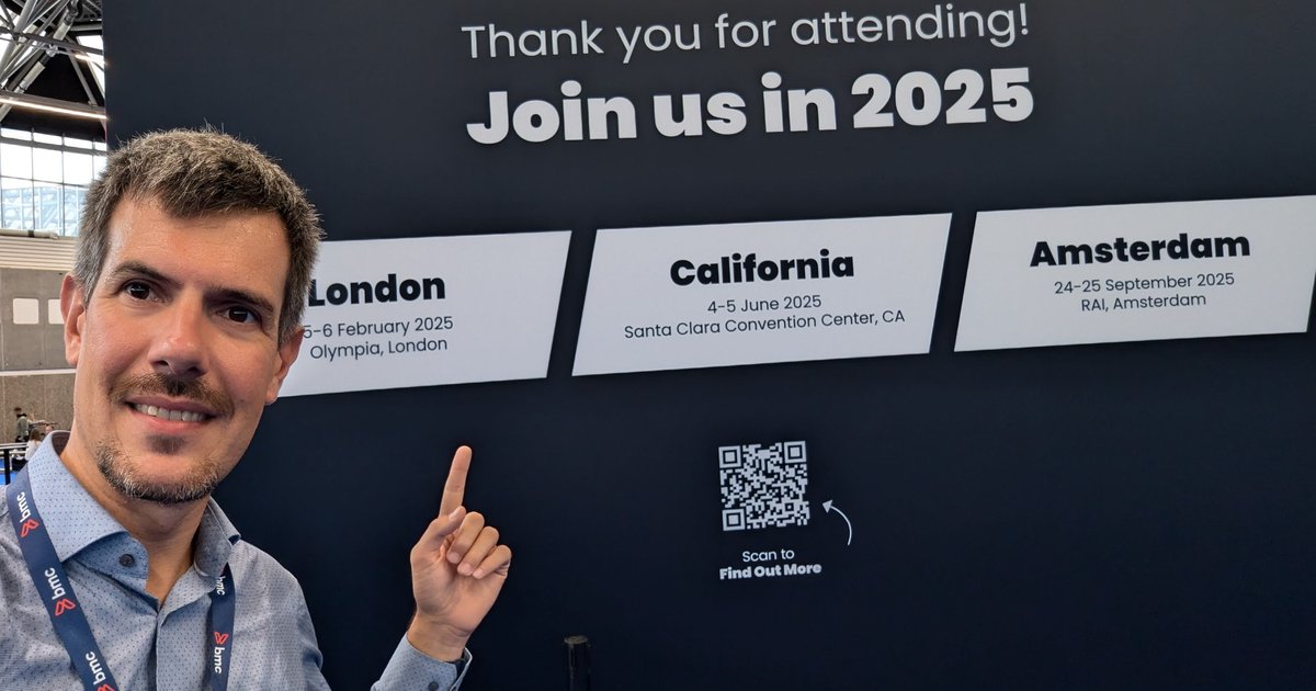 Luca Berton pointing at the TechEx Join us in 2025 wall at the RAI Amsterdam