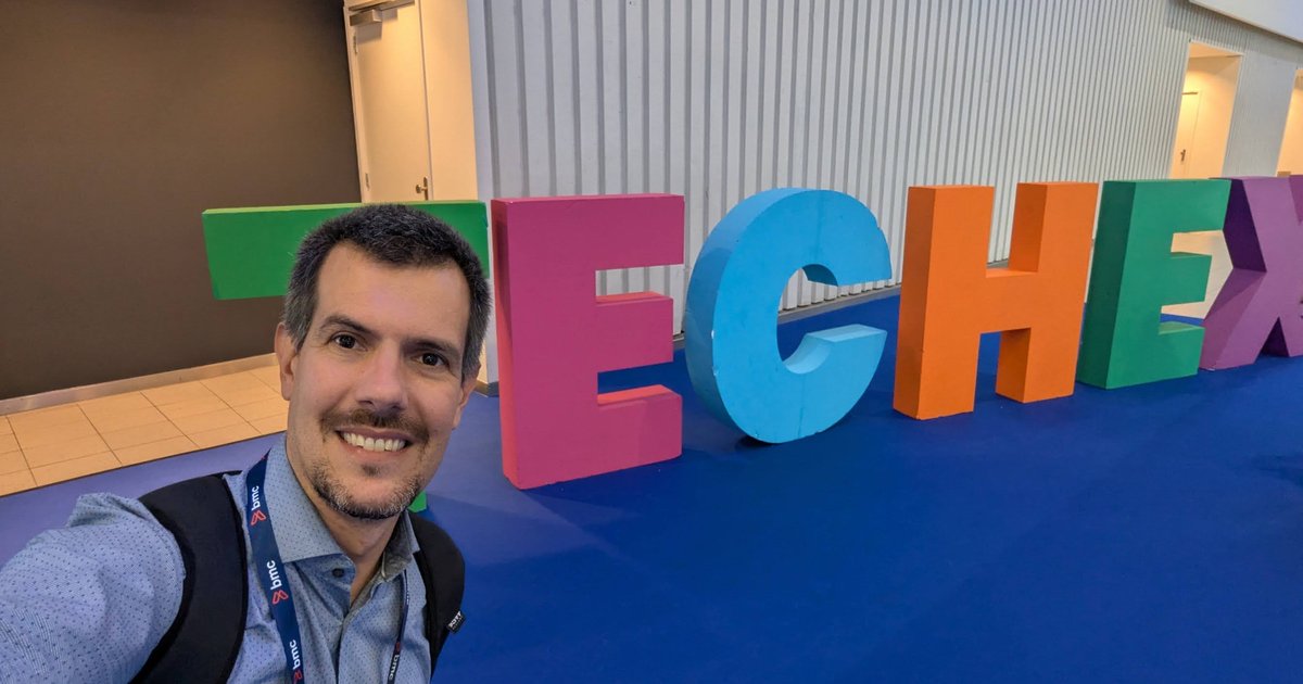 Luca Berton taking a selfie in front of giant colourful TECHEX letters at the RAI Amsterdam
