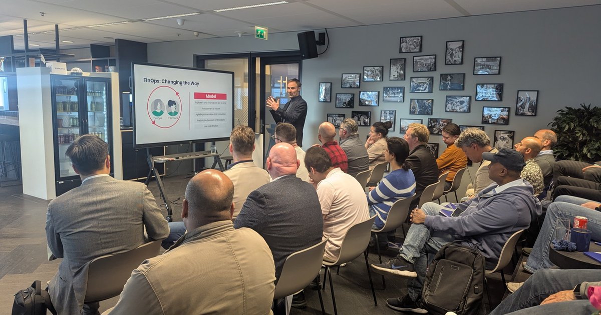 A speaker presenting a FinOps: Changing the Way slide to an audience at the Tergos FinOps meetup in Amsterdam