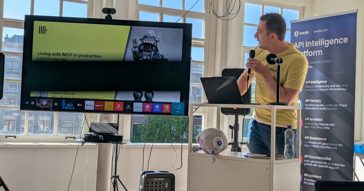 A speaker presenting 'Living with MCP in production' at Treblle's MCP meetup at ML6 in Amsterdam, next to a Treblle API Intelligence Platform banner