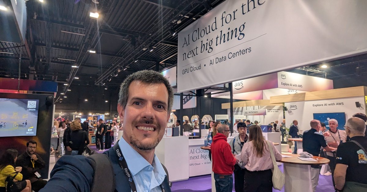 Luca Berton in the World Summit AI 2025 expo hall at Taets, under a sign reading AI Cloud for the next big thing